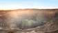 View from above of the pit of an open-pit copper mine in Chile