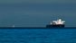 A shipping tanker sailing through the Straight of Hormuz on a sunny day