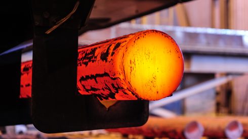 Hot metal blanks coming out of furnace