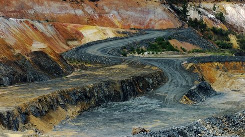 A road runs through an open pit for lithium mining in Australia