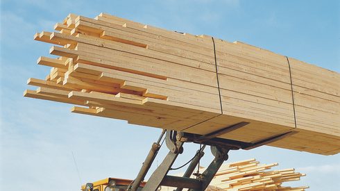 stack of lumber moved by fork lift