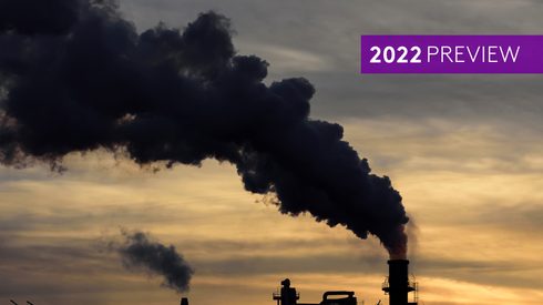 dark skyline with refinery in the background